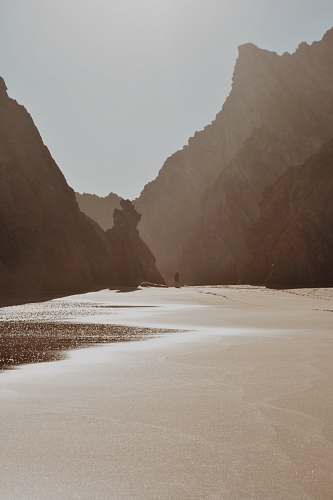portugal man walking near shore beach